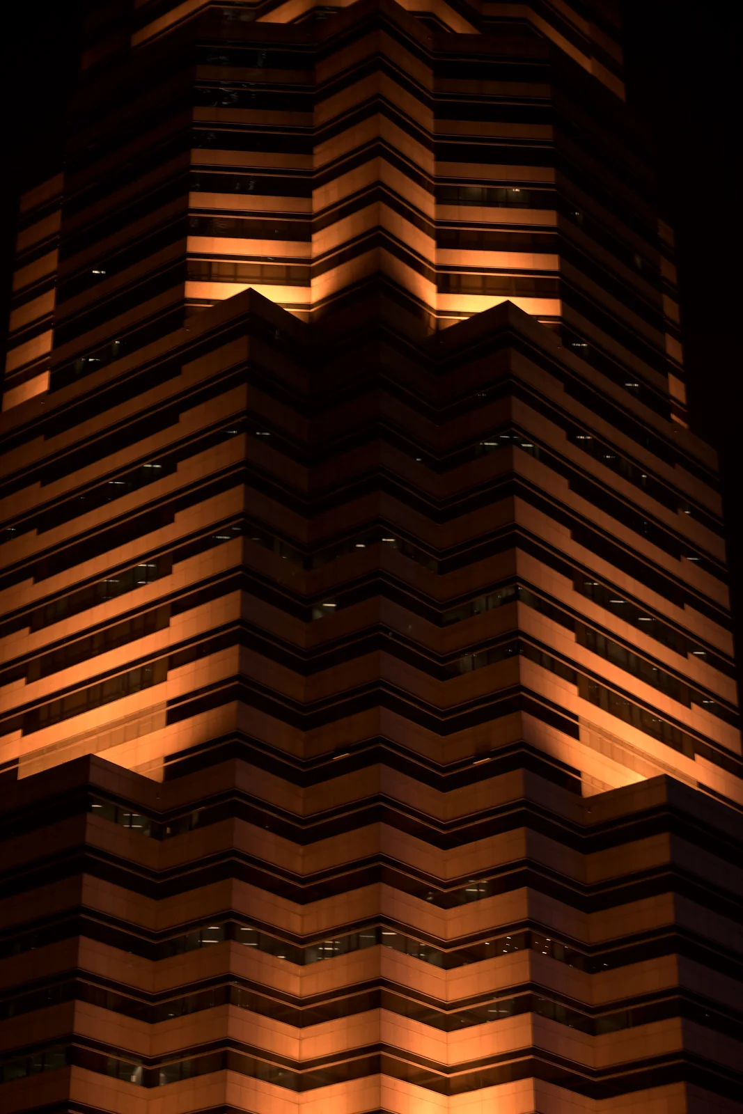 Modern Kuala Lumpur illuminated skyscraper architecture and geometric facade