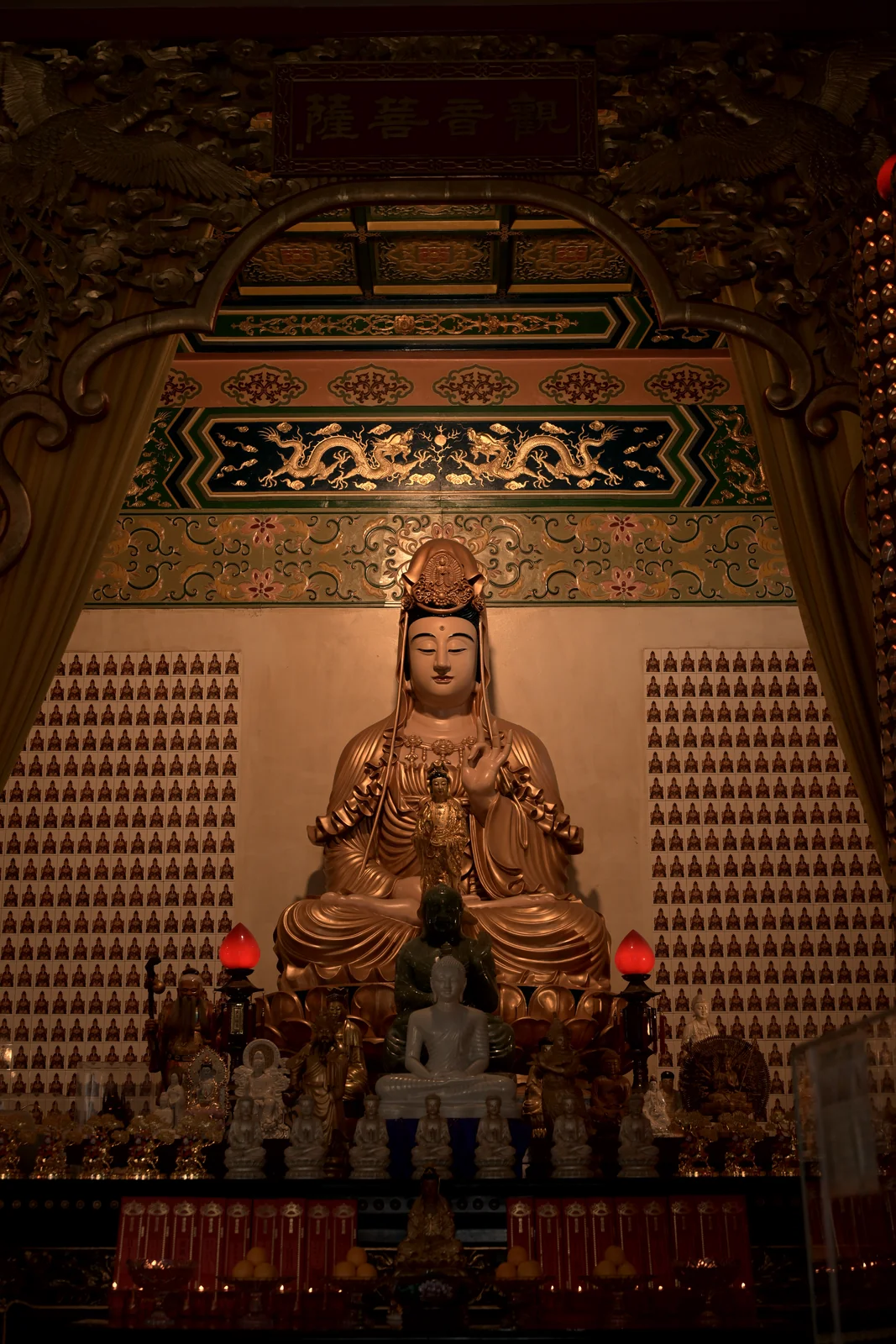 Thean Hou Temple seated goddess Mazu statue surrounded by devotional carvings