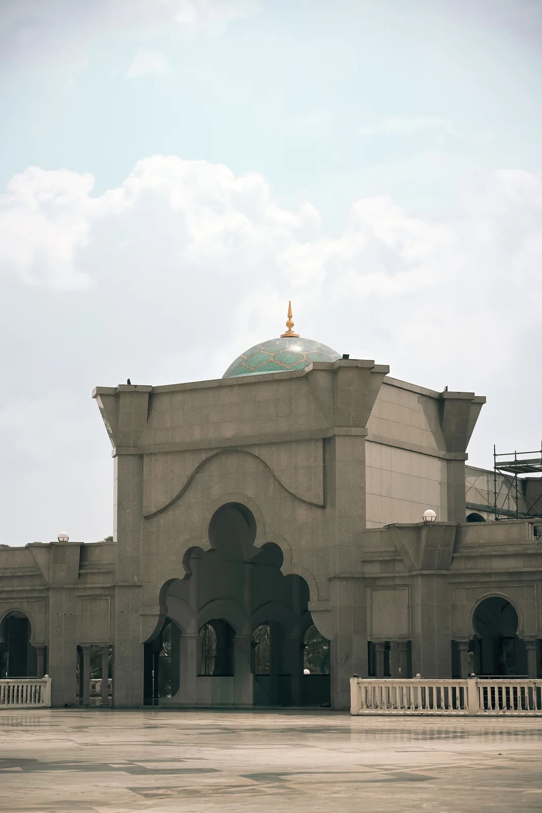 Federal Territory Mosque majestic stone domes under afternoon clouds