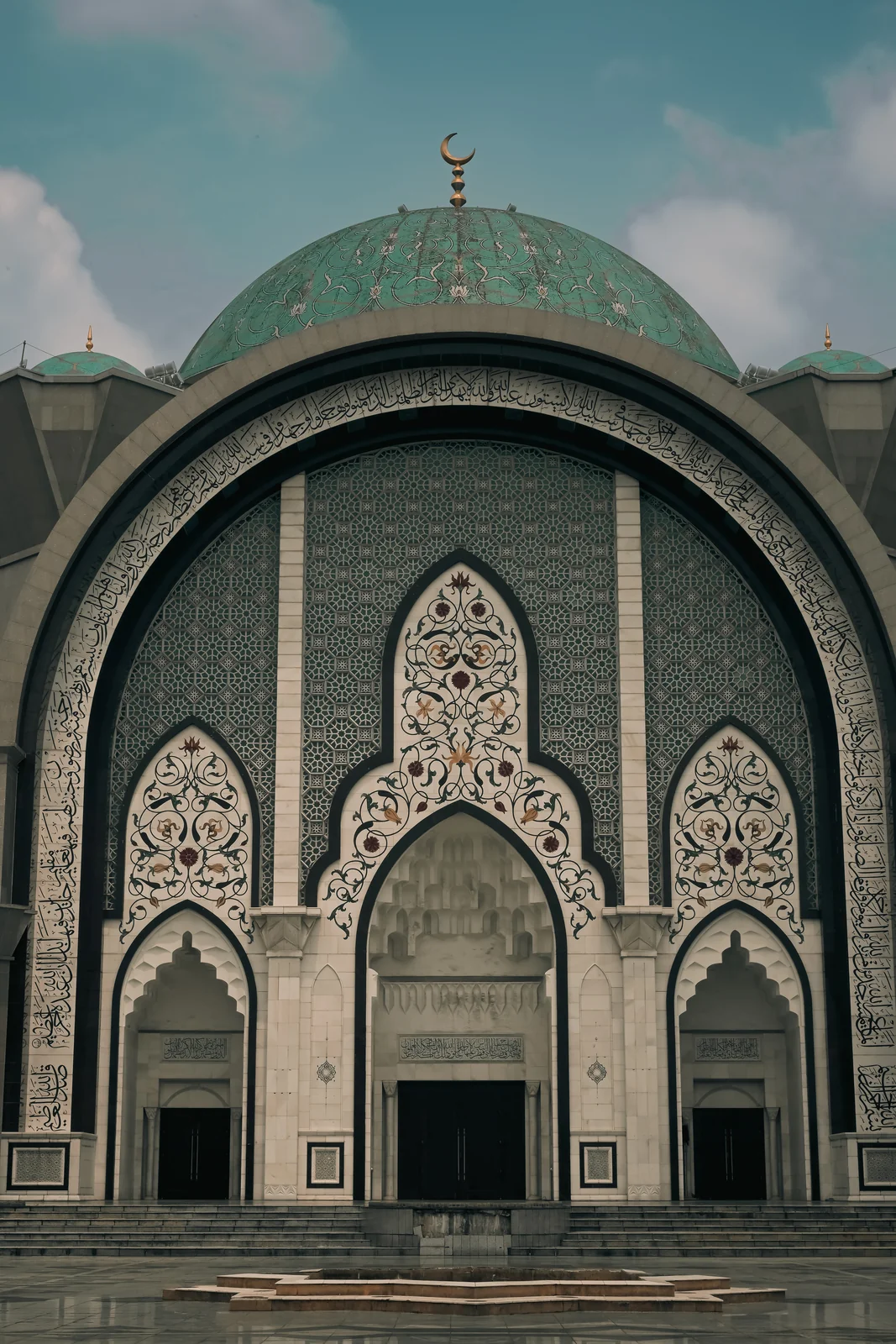 Symmetrical stone grand steps leading to the main entrance of Masjid Wilayah