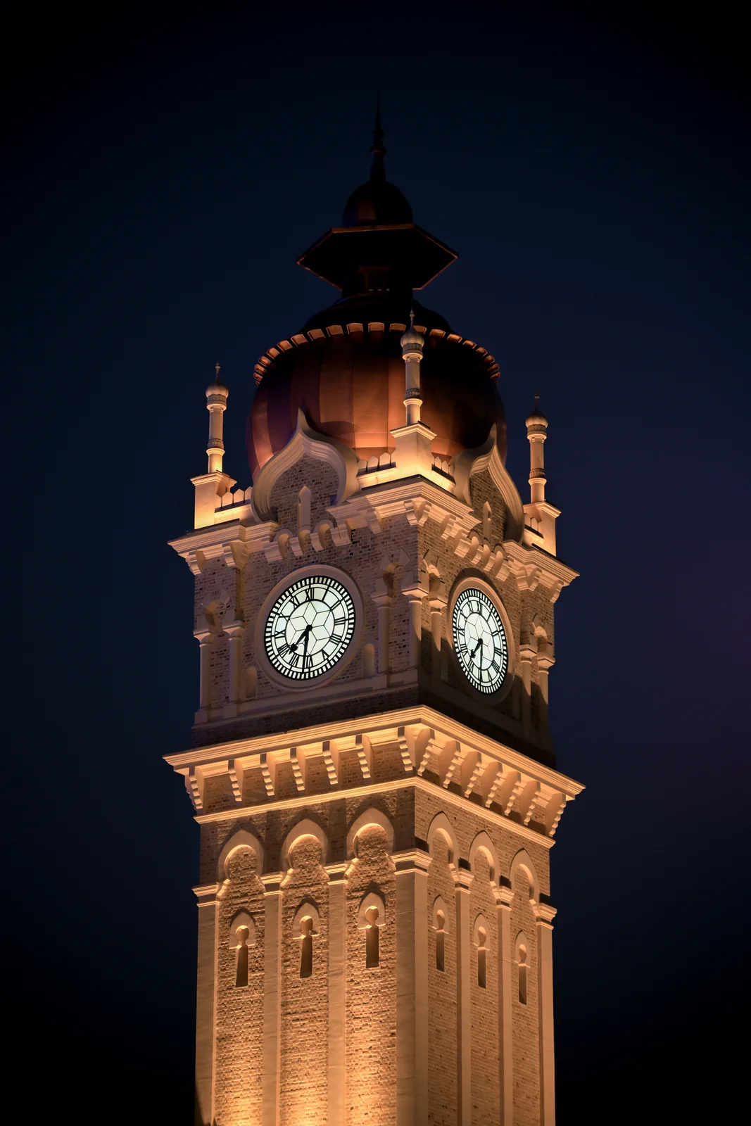 Sultan Abdul Samad clock tower illuminated proudly against dark night sky