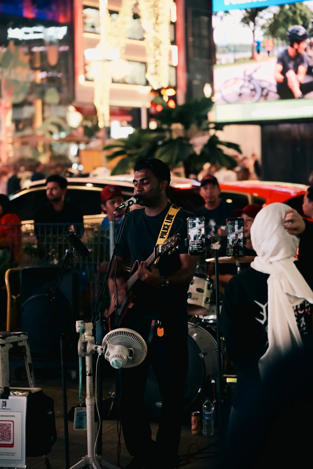 Bukit Bintang vibrant street musicians and bustling nightlife crowd