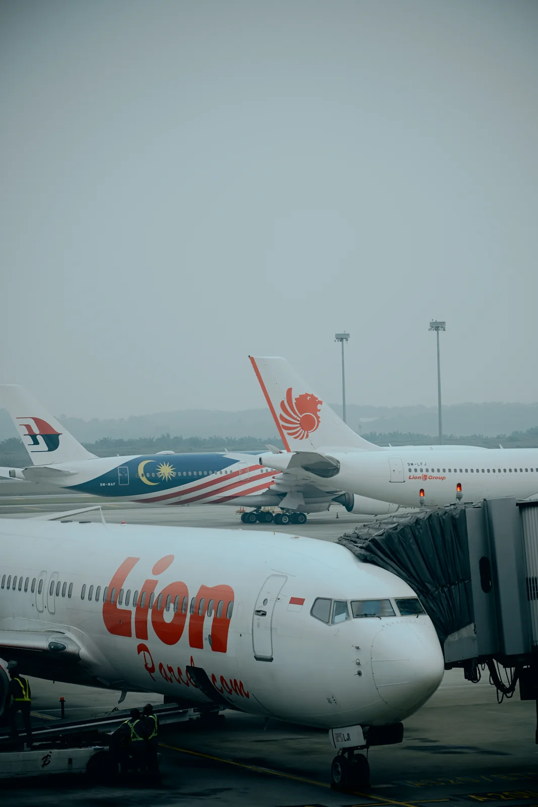 Airport tarmac view with airplane tail marking the journey home