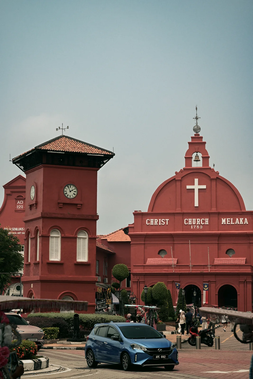 Christ Church Melaka terracotta red colonial facade and bustling square