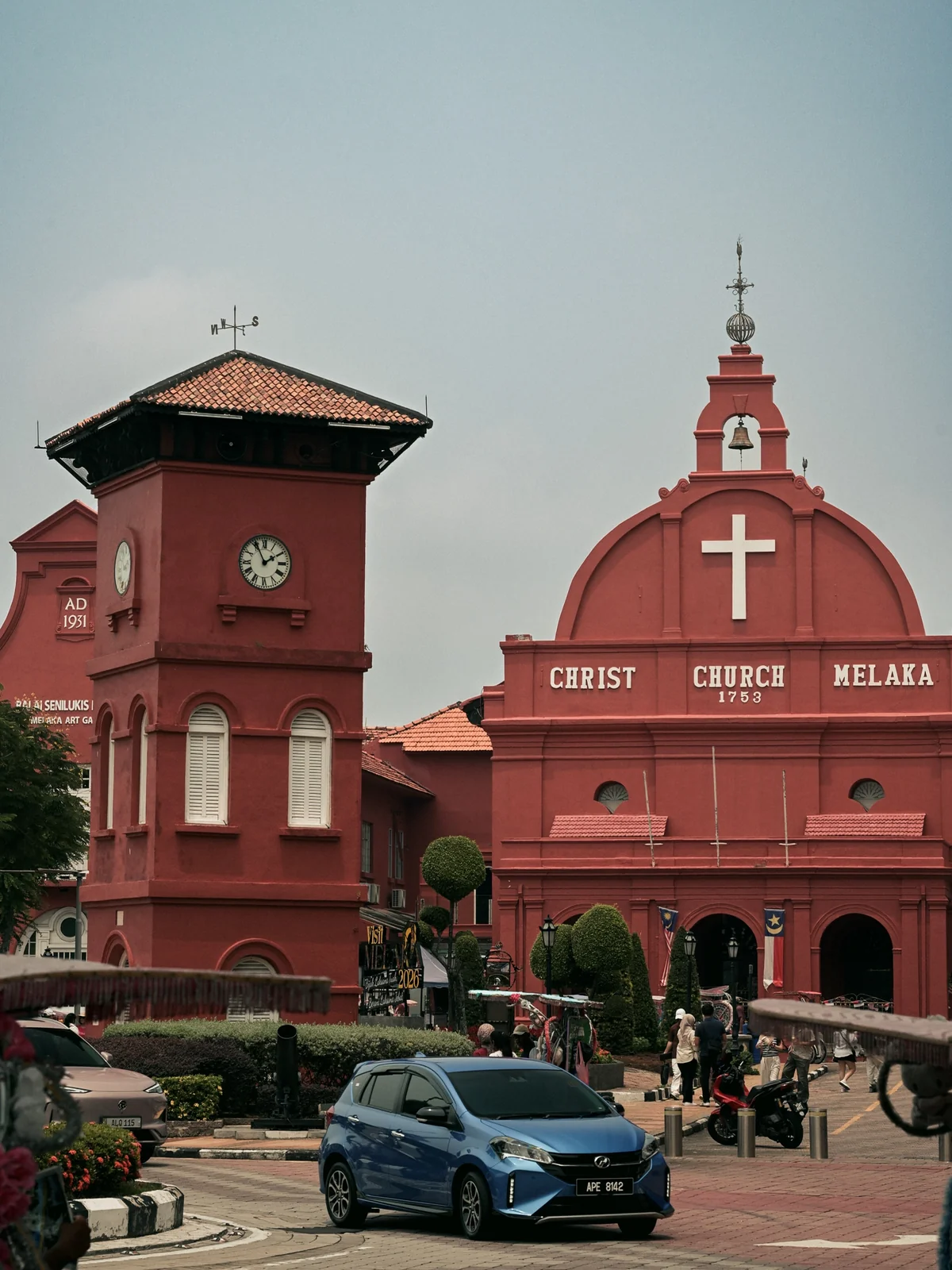 Christ Church Melaka iconic red Dutch colonial church with vintage blue car