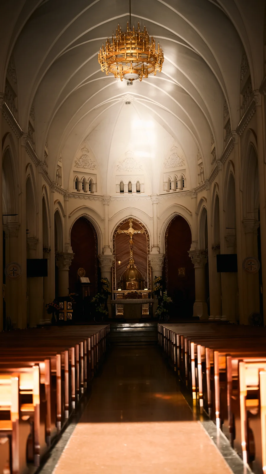 Soaring Gothic vaulted nave and chandelier inside Mỹ Tho Cathedral