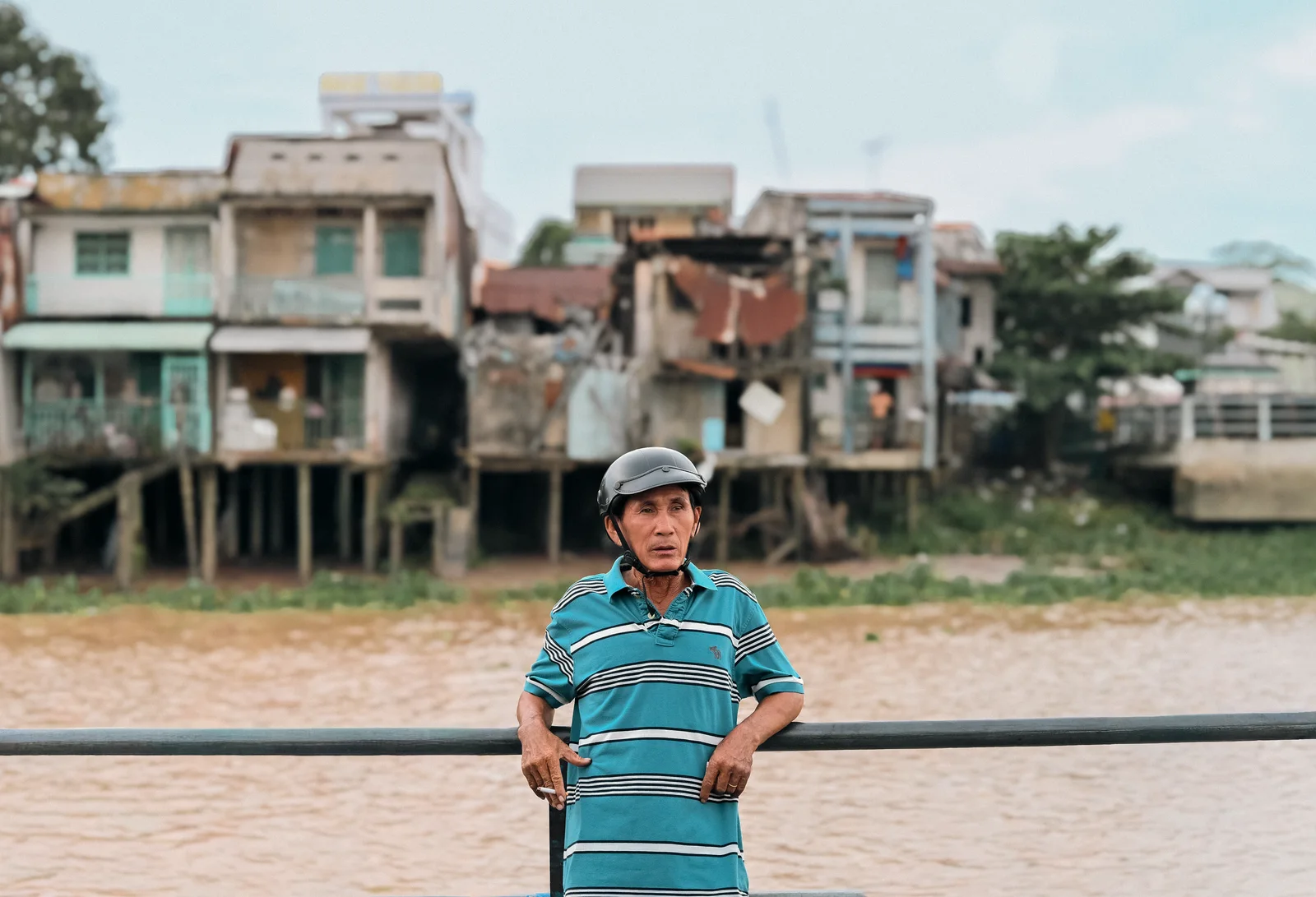 Local passengers and motorbikes crossing Tiền River on the ferry