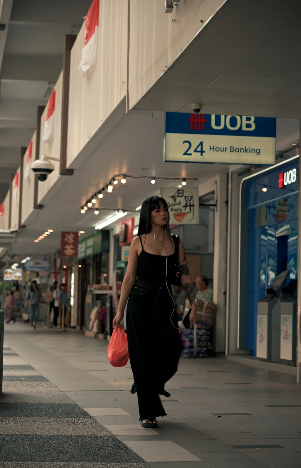 Traveler strolling along covered urban street colonnade